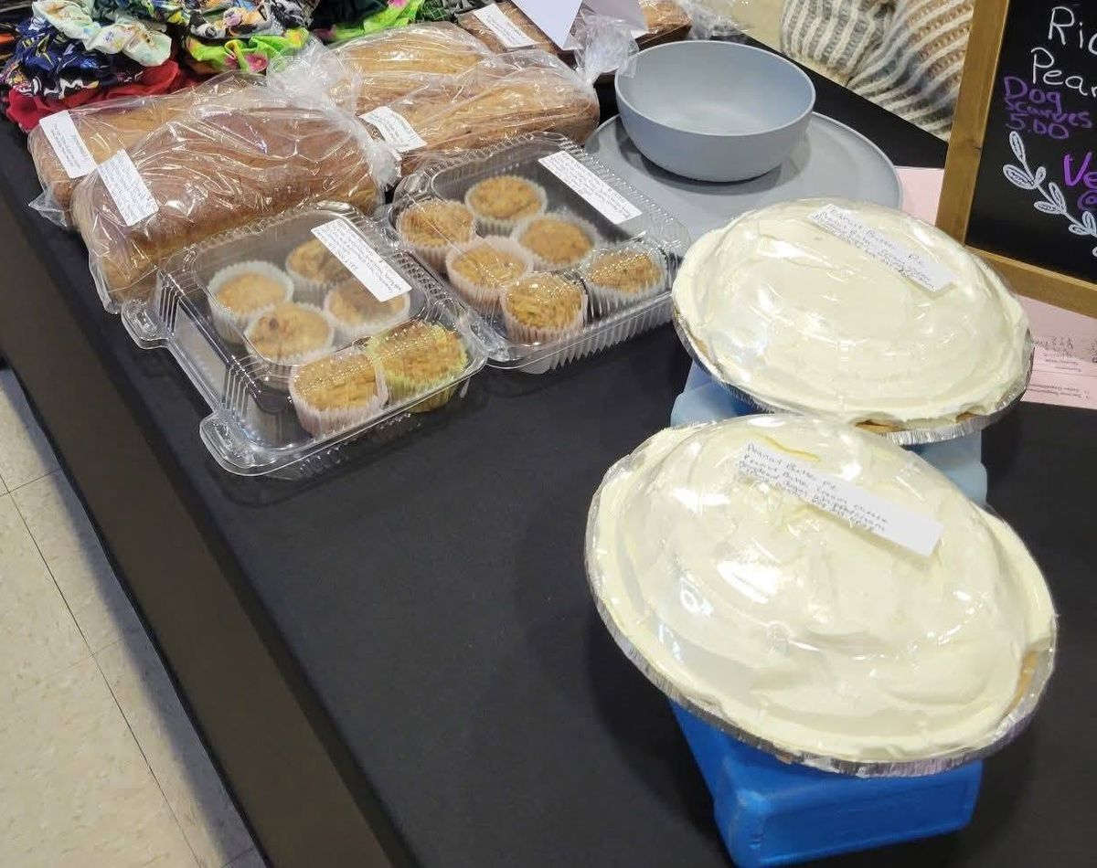 Loco Acres homemade bread loaves, muffins and cream pies on a market table